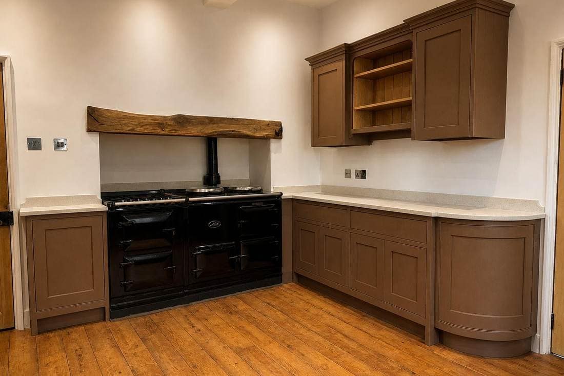 The same kitchen after respraying, with the units in a warm taupe and the open shelving painted to match