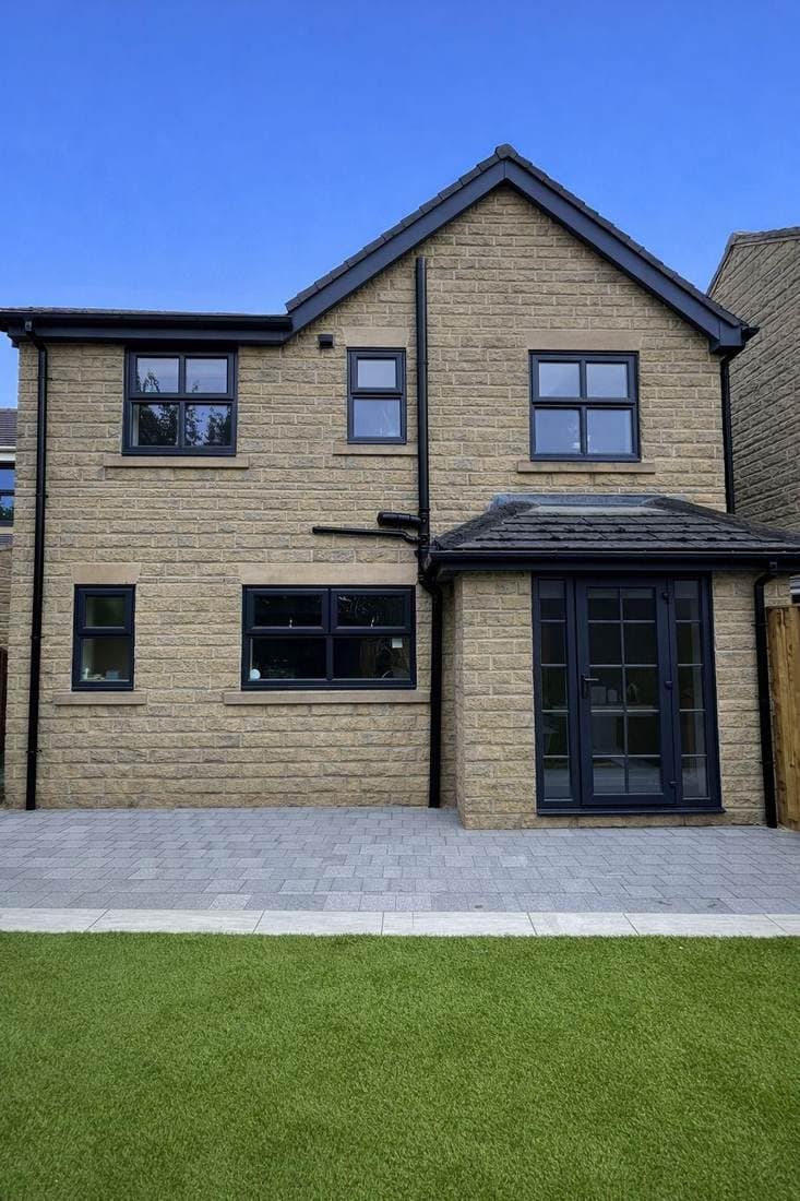 The same elevation after spraying, with every window and the french doors in anthracite