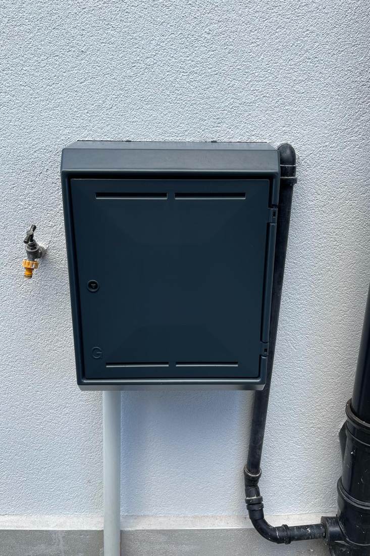 A meter box after spraying in anthracite to match the frames around it